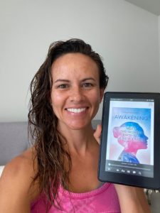 woman holding her tablet with the book of AMA Publishing