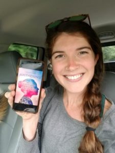 Person Showing her phone screen with the awakening book